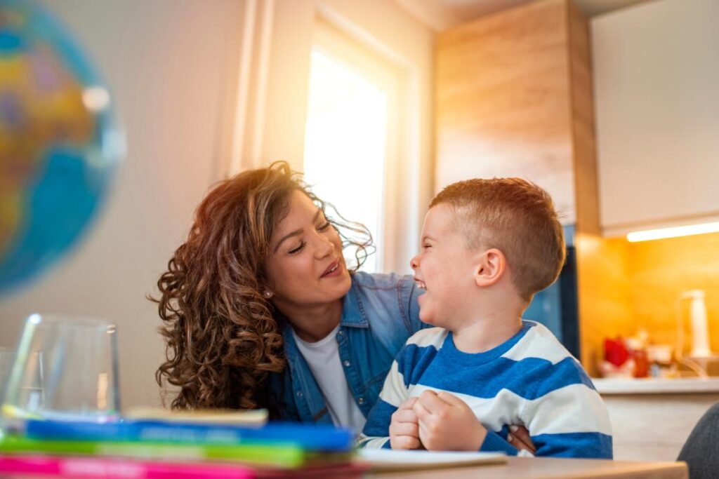 Woman and child share a smile and laugh