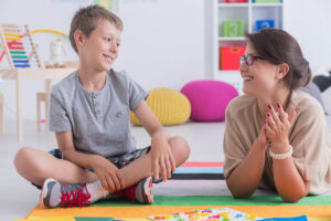 child practicing pragmatic language skills with parent