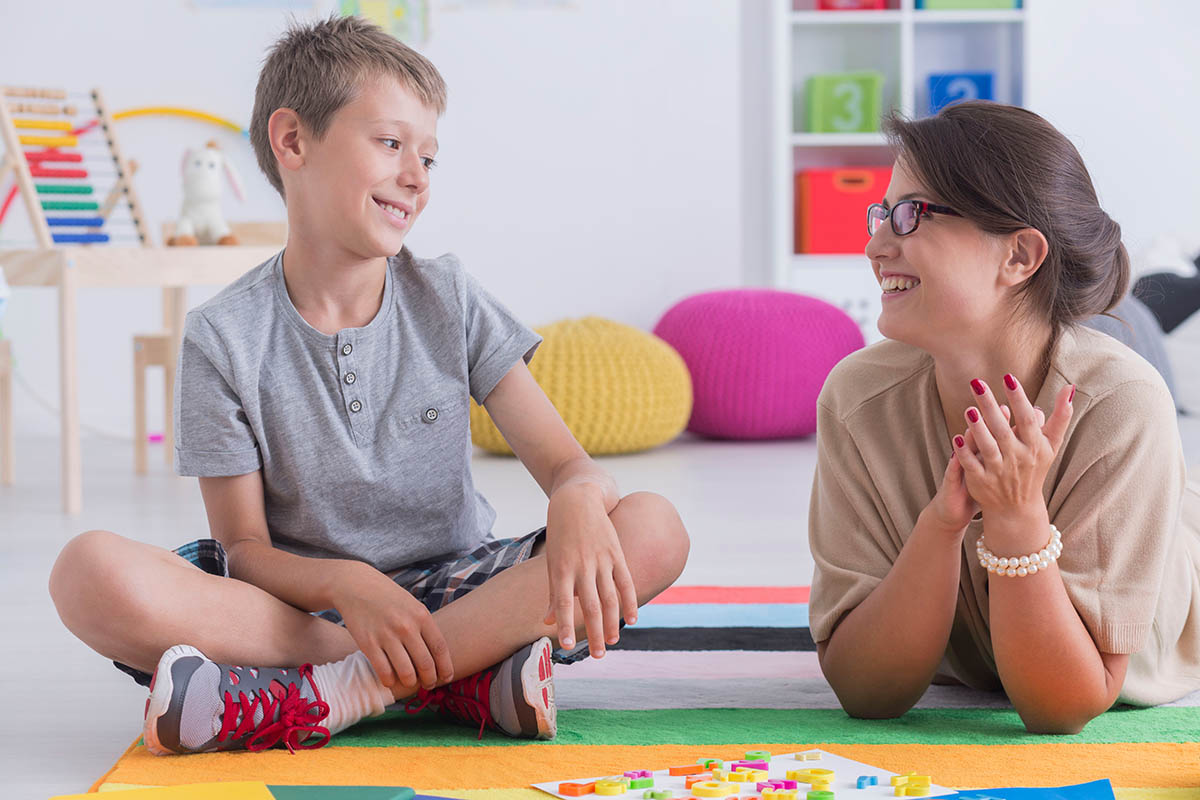 child practicing pragmatic language skills with parent