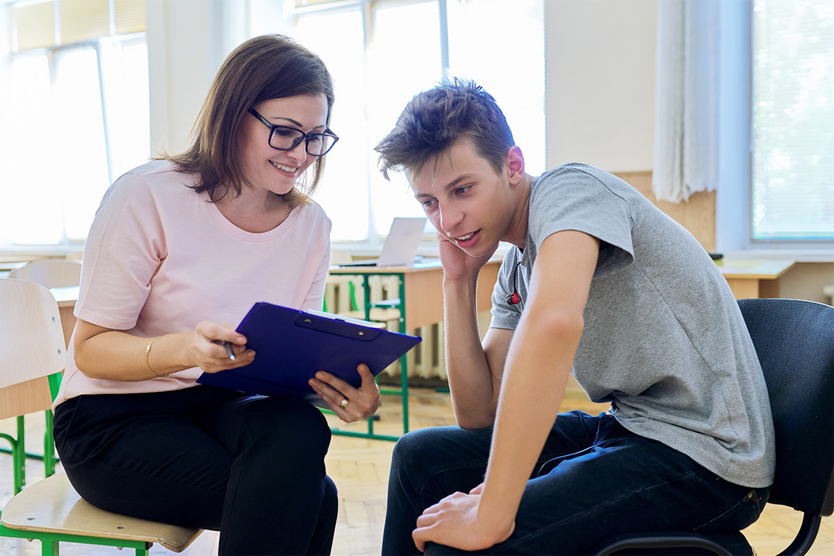 person working with child after answering the question what are the benefits of center-based aba therapy