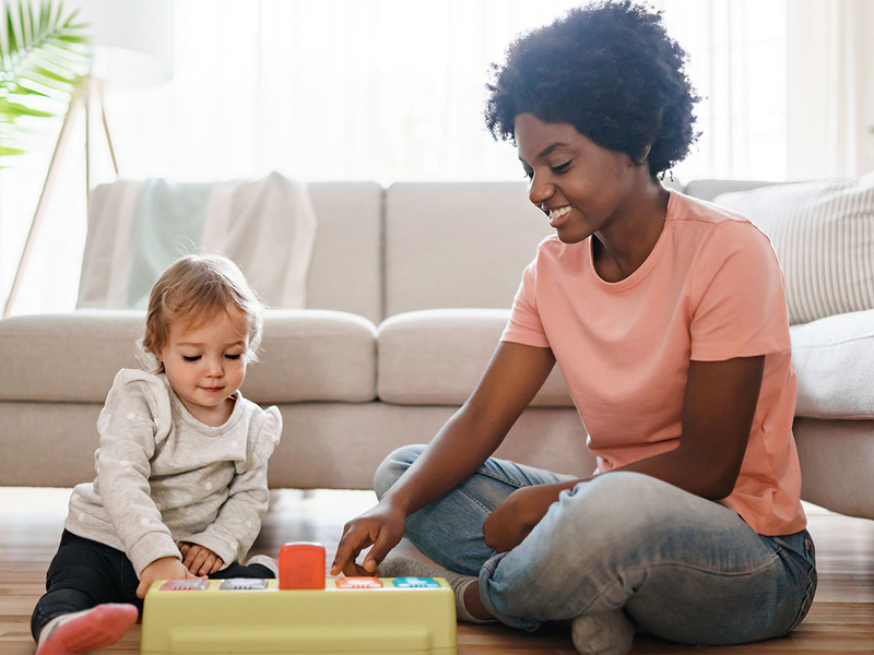 Therapist and Child using educational toy