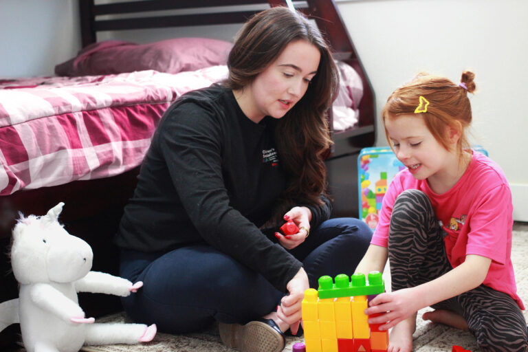 BCBA working in-home with child on fine motor skills