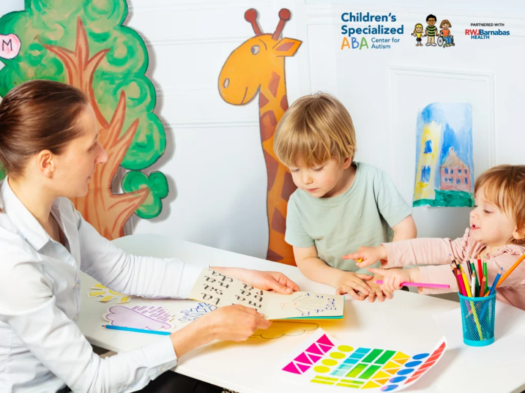 Therapist working with child on developmental activities during ABA session