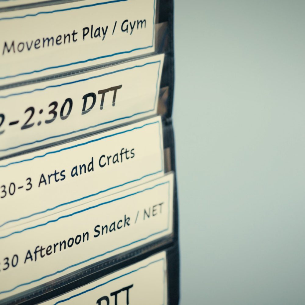 Hanging cards showing a daily schedule.